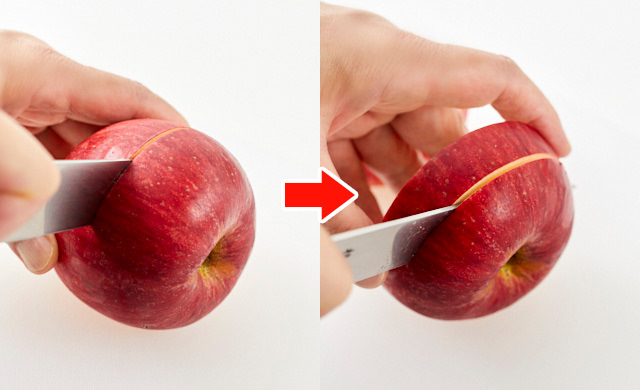 りんごを輪切りにする写真