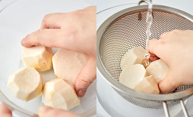 里芋を塩で揉んでいる写真